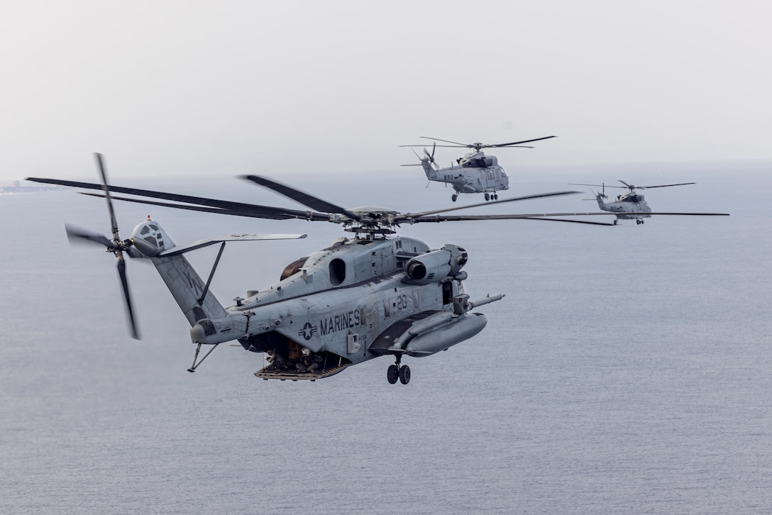 A CH-53E Super Stallion with Marine Heavy Helicopter Squadron (HMH) 466, Marine Air Group 36, 1st Marine Air Wing and two MUH-1 Marineon helicopters with 2nd Helicopter Squadron, Republic of Korea Marine Air Group, fly in formation during Warrior Shield 24 off the coast of Pohang, South Korea, Feb. 28, 2024. Warrior Shield 24 is an annual joint, combined exercise in the Republic of Korea that strengthens the combined defensive capabilities of ROK-U.S Forces. This routine, regularly scheduled, field training exercise provides the ROK-U.S Marines the opportunity to rehearse combined operations, exchange knowledge, and demonstrate the strength and capability of the ROK-U.S Alliance. (U.S. Marine Corps photo by Lance Cpl. Sav Ford)