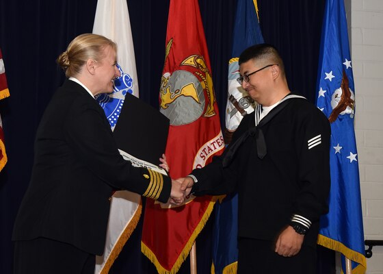 JOINT BASE SAN ANTONIO-FORT SAM HOUSTON – (March 27, 2024) – Capt. Jennifer Buechel, of Woodhaven, Mich., commanding officer, Naval Medical Research Unit (NAMRU) San Antonio, congratulates Navy Seaman Weiqiang Ma, 40, of China, on becoming an U.S. citizen during the U.S. Citizenship Naturalization Oath Ceremony held at the Military and Family Readiness Center.  Fifteen service members from the U.S. Army, Navy, and Air Force became U.S. citizens from the countries of China, Kenya, Jamaica, Nigeria, Vietnam, Venezuela, and The Philippines. Buechel, a Navy nurse, delivered the keynote address. NAMRU San Antonio’s mission is to conduct gap driven combat casualty care, craniofacial, and directed energy research to improve survival, operational readiness, and safety of Department of Defense (DoD) personnel engaged in routine and expeditionary operations. It is one of the leading research and development laboratories for the U.S. Navy under the DoD and is one of eight subordinate research commands in the global network of laboratories operating under the Naval Medical Research Command in Silver Spring, Md. (U.S. Navy photo by Burrell Parmer, NAMRU San Antonio Public Affairs/Released)