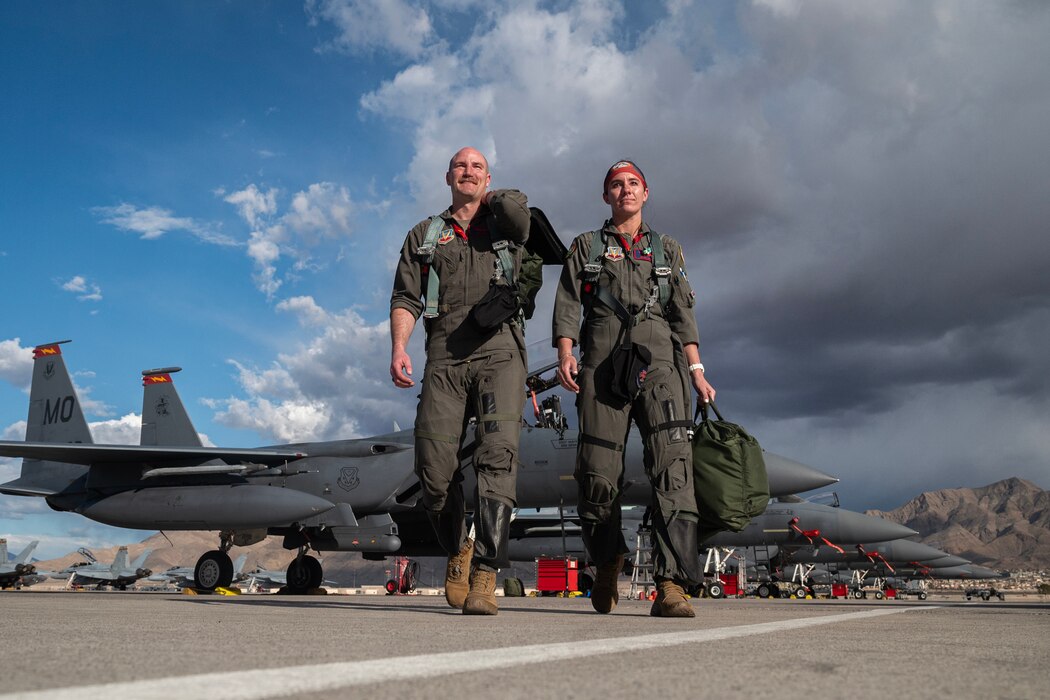 Maj. Nathan Persons and Capt. Annie Braun, weapon systems officers assigned to the 366th Fighter Wing, Mountain Home Air Force Base, Idaho, depart an F-15E Strike Eagle