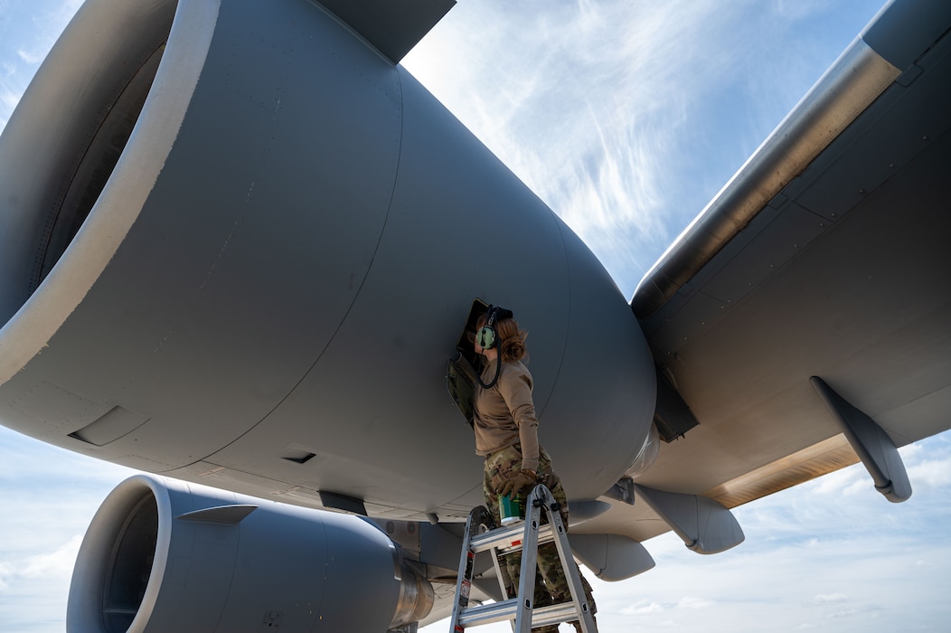Airman 1st Class Lyric Kennedy, 62nd Aircraft Maintenance Squadron aerospace propulsion journeyman, performs maintenance on one of the four engines of the C-17 Globemaster III