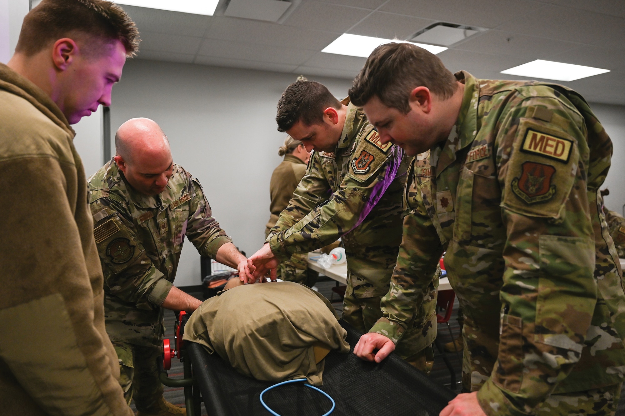 Tech. Sgt. Anthony Marrazzi, 445th Aerospace Medicine Squadron flight and operational medical technician, gives instructions on treating airway during Tactical Combat Casualty Care (TCCC) training held March 12, 2024.