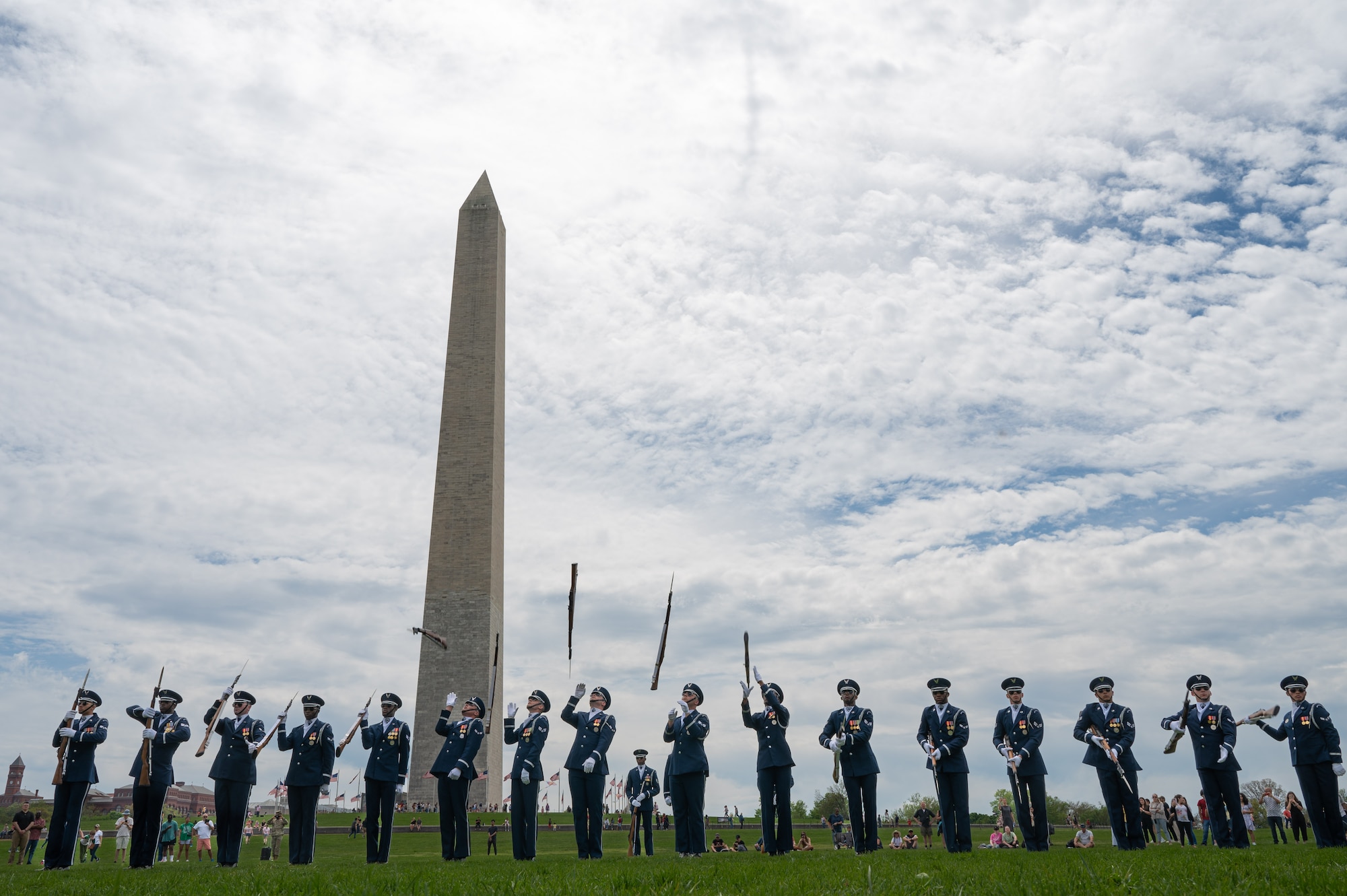 The United States Air Force Honor Guard Drill Team performs their routine during the Joint Services Drill Exhibition, April 14, 2023, at the Washington Monument, Washington, D.C. The Honor Guard Drill Team’s mission is to promote the Air Force mission by showcasing drill performances at public and military venues to recruit, retain and inspire Airmen. (U.S. Air Force photo by Airman 1st Class Bill Guilliam)