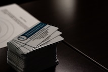 Business cards from the Sexual Assault Prevention and Response (SAPR) office are displayed in the back of the TEAL training course at Minot Air Force Base, North Dakota, March 26, 2024. The Air Force encourages accountability for those who commit sexual assaults as well as sensitive care and private reporting for victims of these crimes. (U.S. Air Force photo by Airman 1st Class Alyssa Bankston)