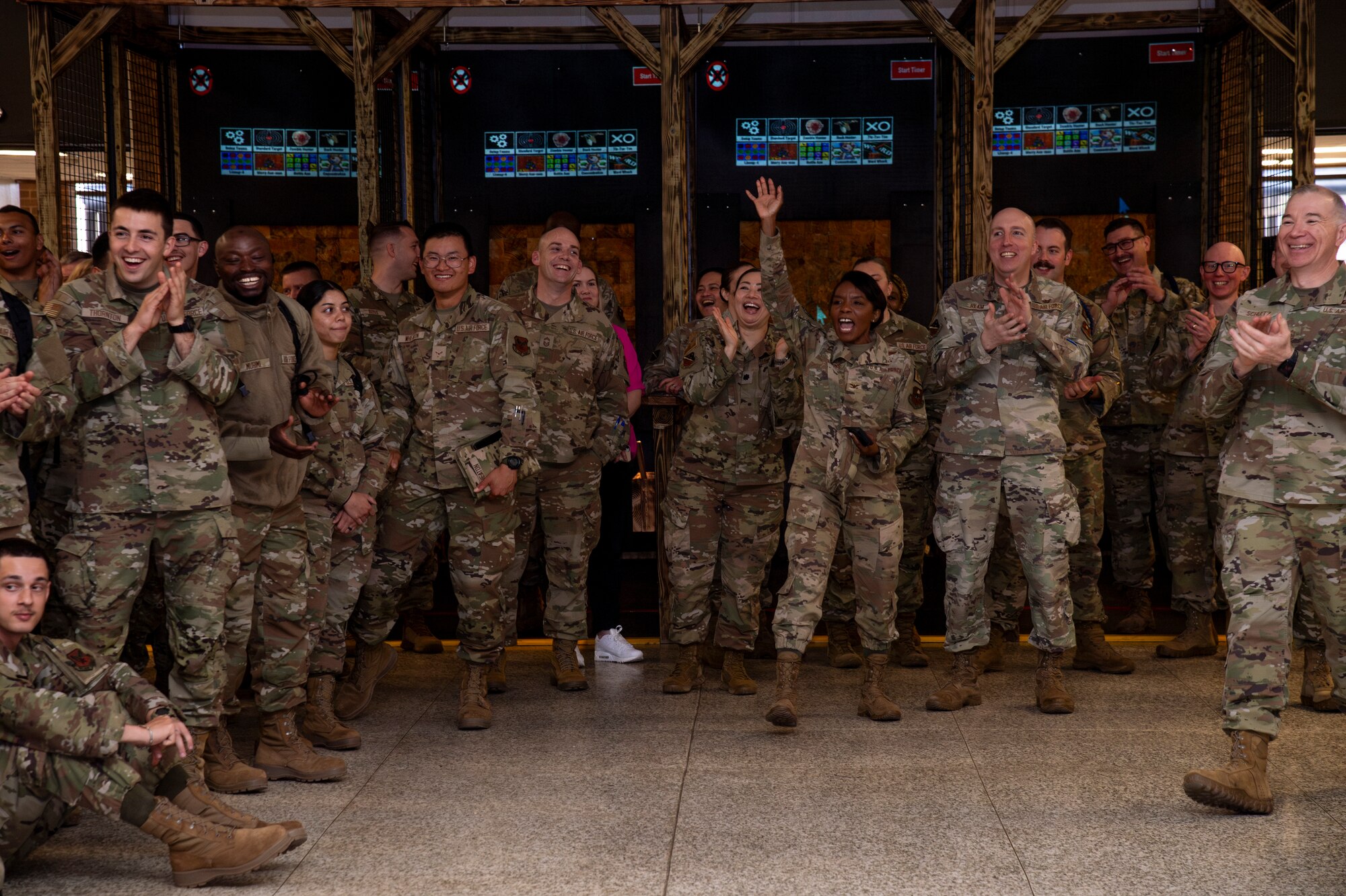 Airmen stand in a group during a function