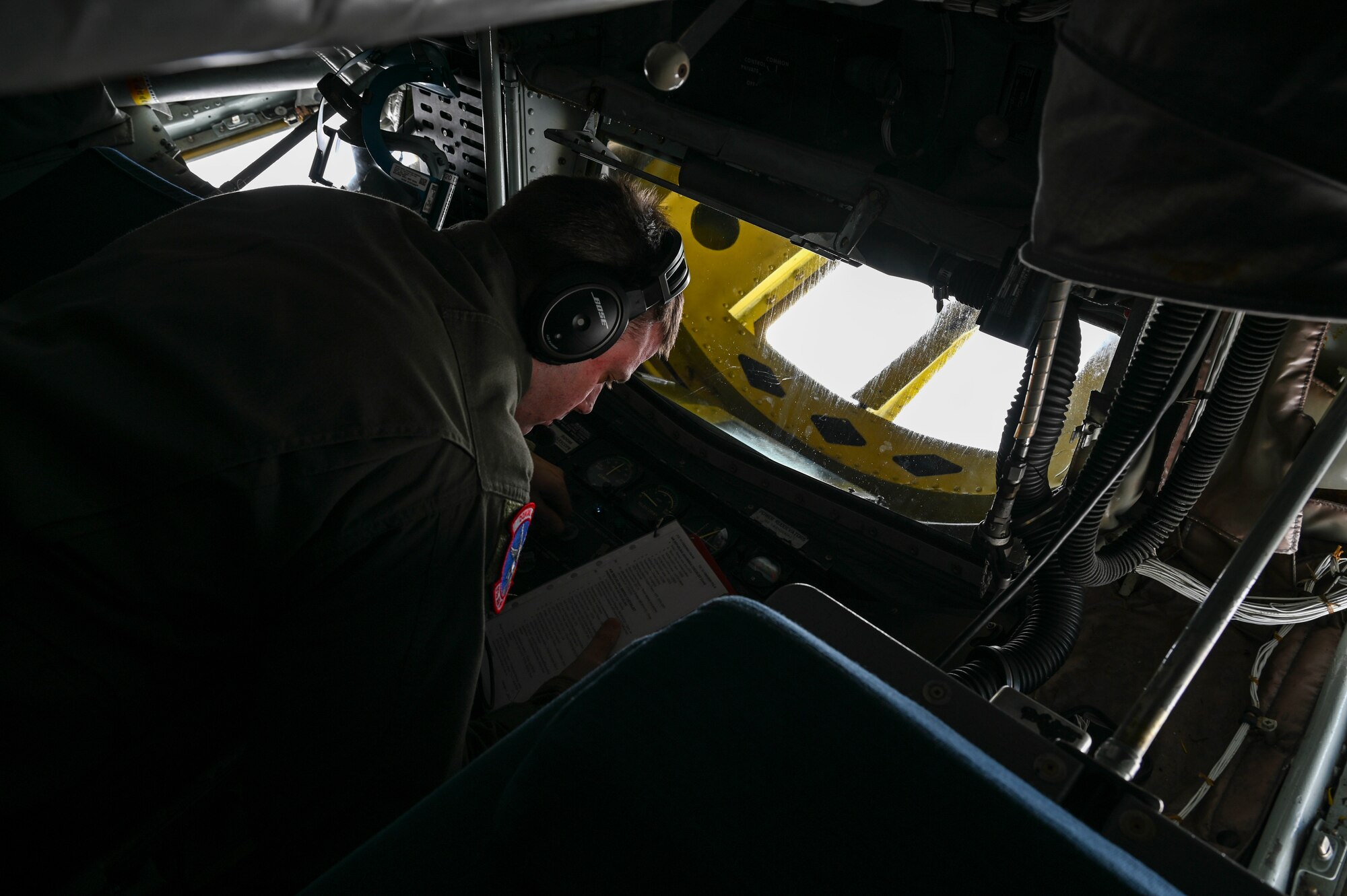 An Airman reads a checklist.