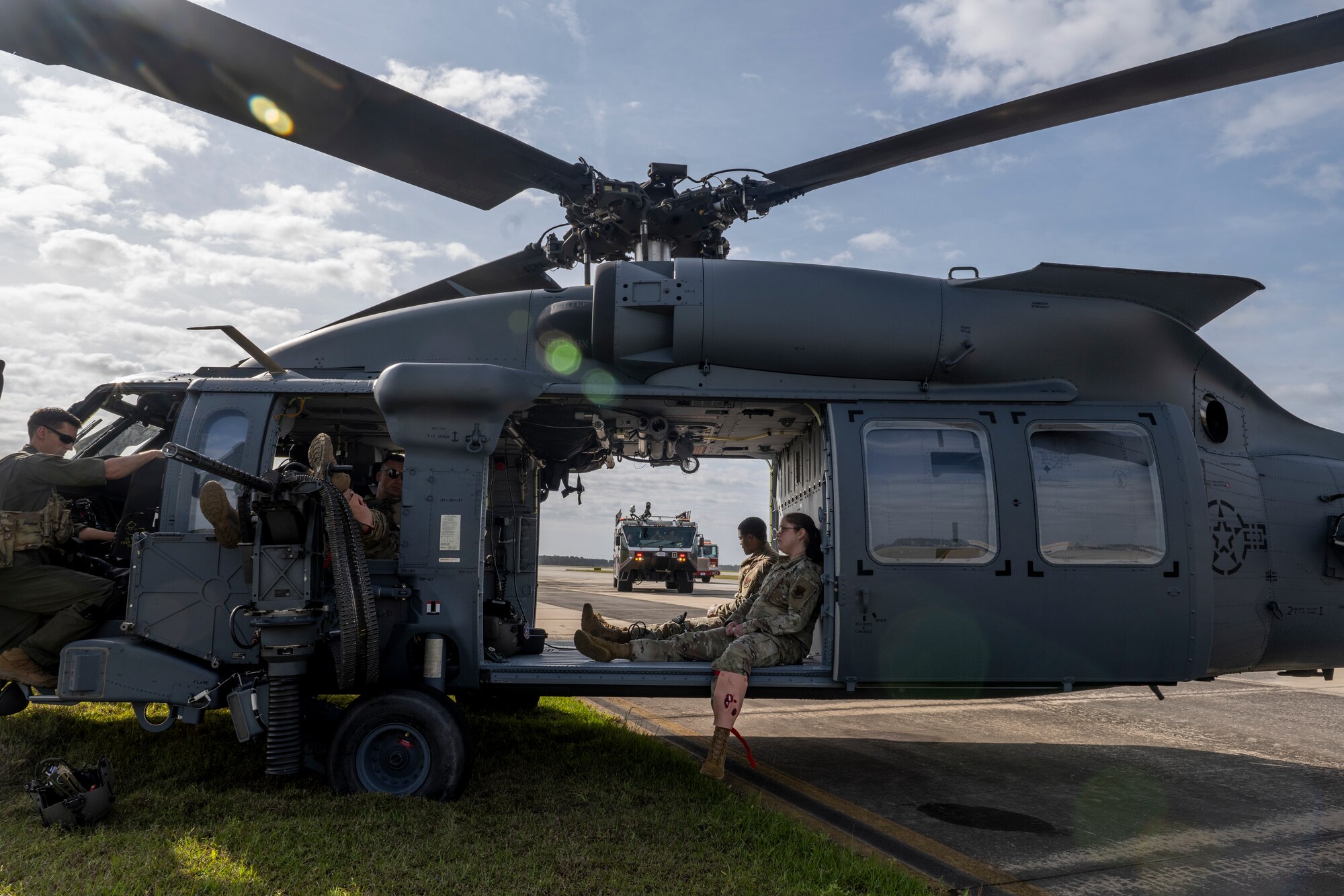 U.S. Air Force Airmen assigned to the 23rd Wing await assistance during a simulated aircraft accident response exercise at Moody Air Force Base, Georgia, March 26, 2024. During the exercise, four simulated patients required evaluation and treatment. (U.S. Air Force photo by Senior Airman Deanna Muir)