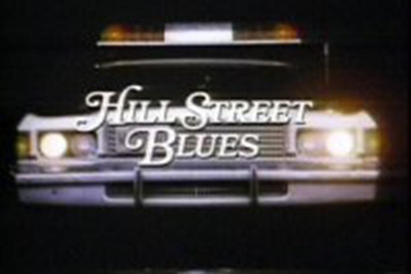 A screen shot of a police car in the background with the words Hill Street Blues in front.