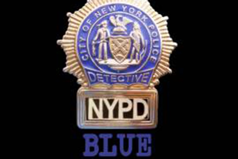 A poster displaying a New York police detective badge. The word BLUE written is underneath.