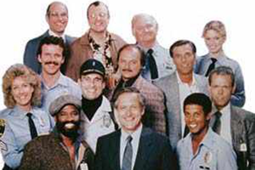 A group of actors pose for a photo.