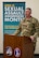 A man dressed in Army green camouflage is speaking from a brown pulpit. Behind him is a tall teal-colored sign with the words April is Sexual Assault Awareness and Prevention Month (SAAPM) and other illegible words