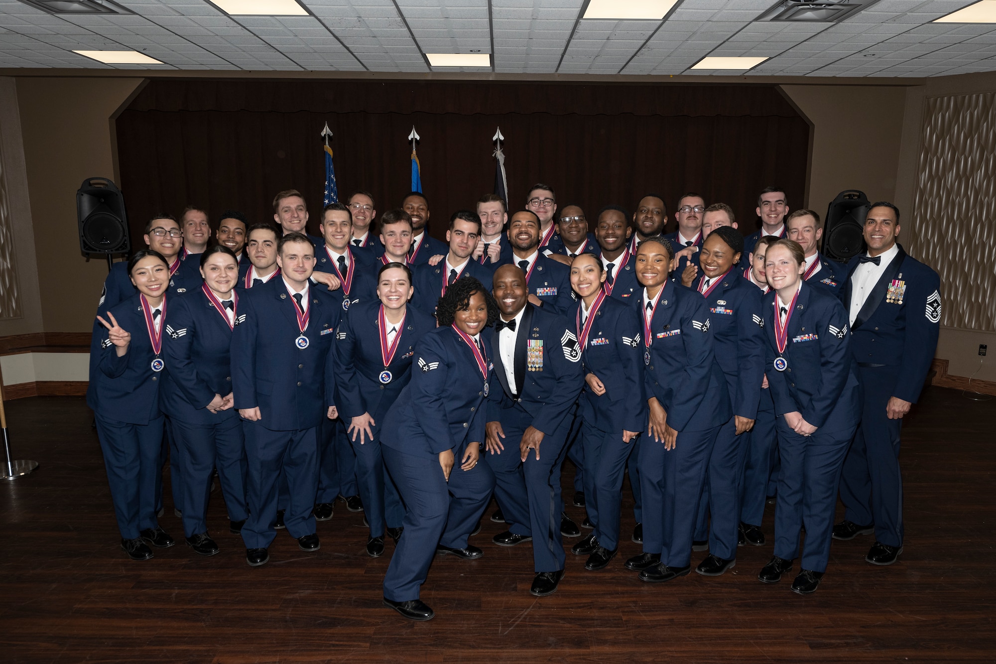 Group photo of ALS grads and guest speaker.