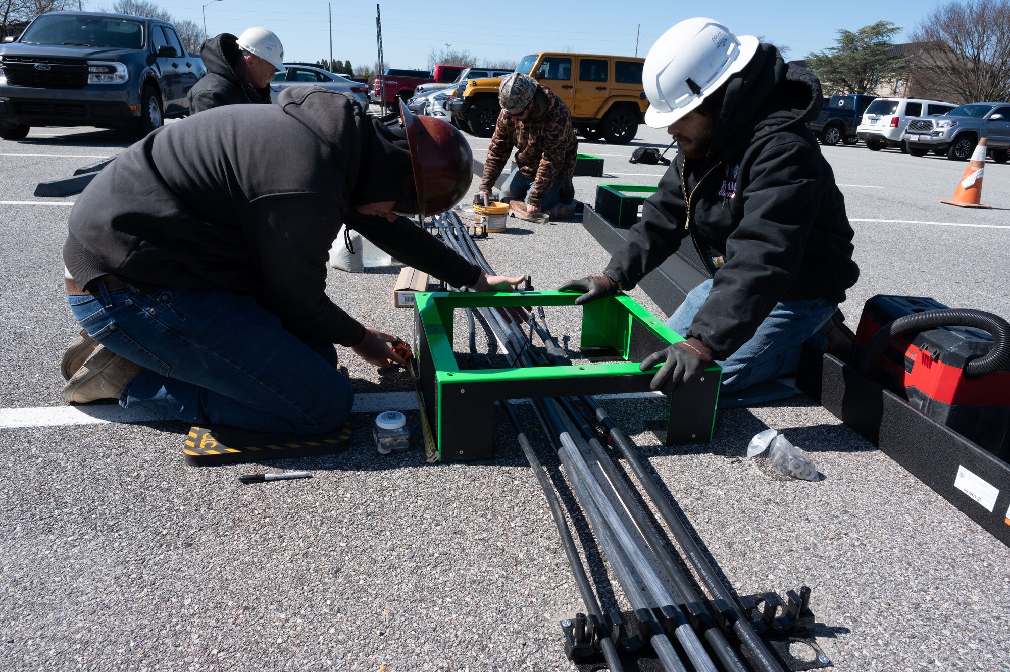 Contractors install an electric vehicle charging station at Dover Air Force Base, Delaware, March 25, 2024. Team Dover’s switch to EV’s began in November 2022 and is currently in phase three of the five-phase process; it is anticipated to be completed by the end of 2024. (U.S. Air Force photo by Airman 1st Class Dieondiere Jefferies)