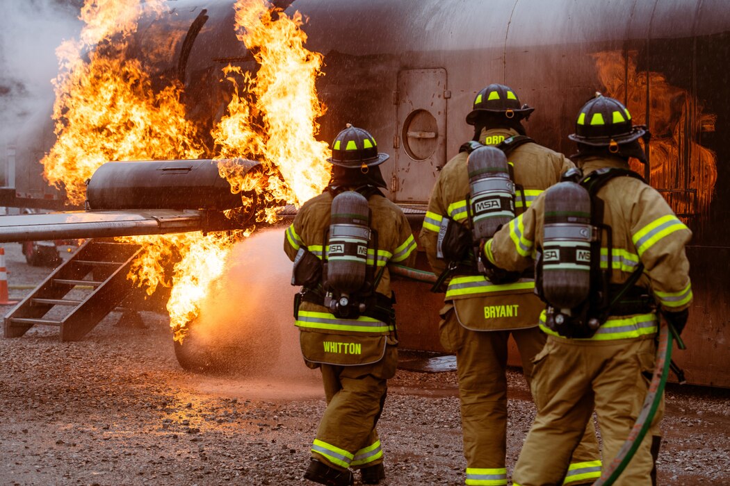 Arnold Air Force Base Fire and Emergency Services firefighters combat a simulated aircraft engine fire during fuselage fire training March 5, 2024, at Arnold AFB, Tenn., headquarters of Arnold Engineering Development Complex. Arnold FES crews took part in live structural fire training Feb. 27-29, 2024, and live aircraft fire training March 5-7, 2024. (U.S. Air Force photo by Keith Thornburgh)