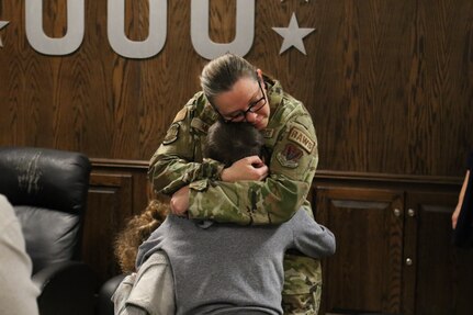 U.S. Airmen with the 211th Engineering Installation Squadron, 193rd Regional Support Group, 193rd Special Operations Wing, say goodbye to their loved ones at Fort Indiantown Gap, Pennsylvania, in 2023 before leaving for a six-month deployment.