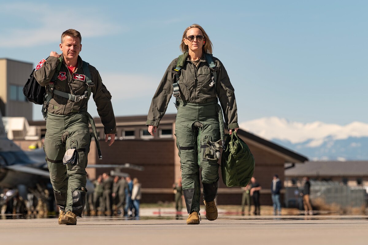 People walk on flight line