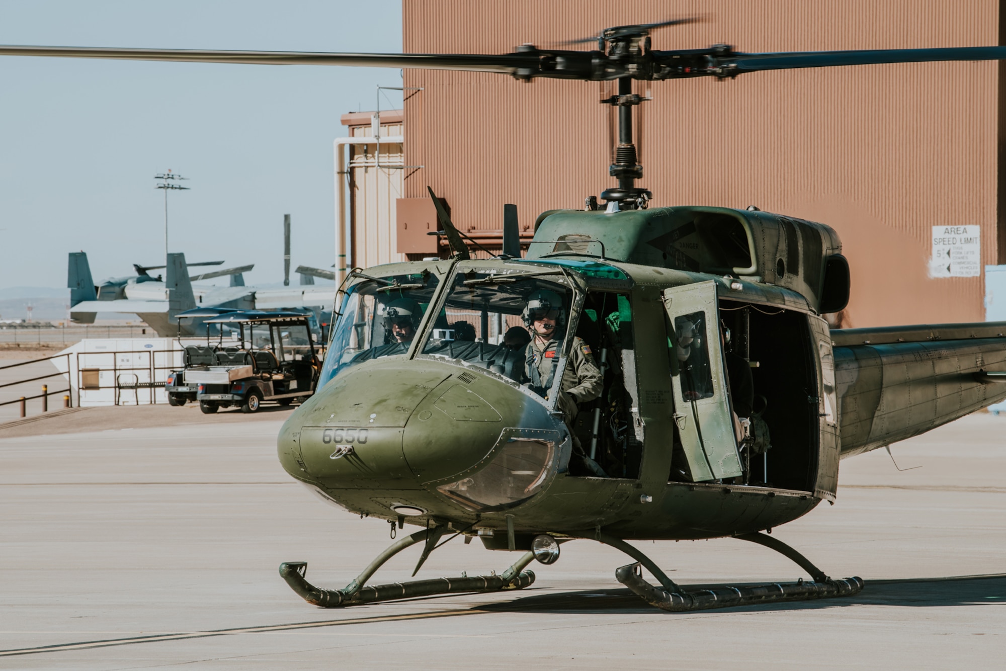 A UH-1N “Huey" prepares for take off