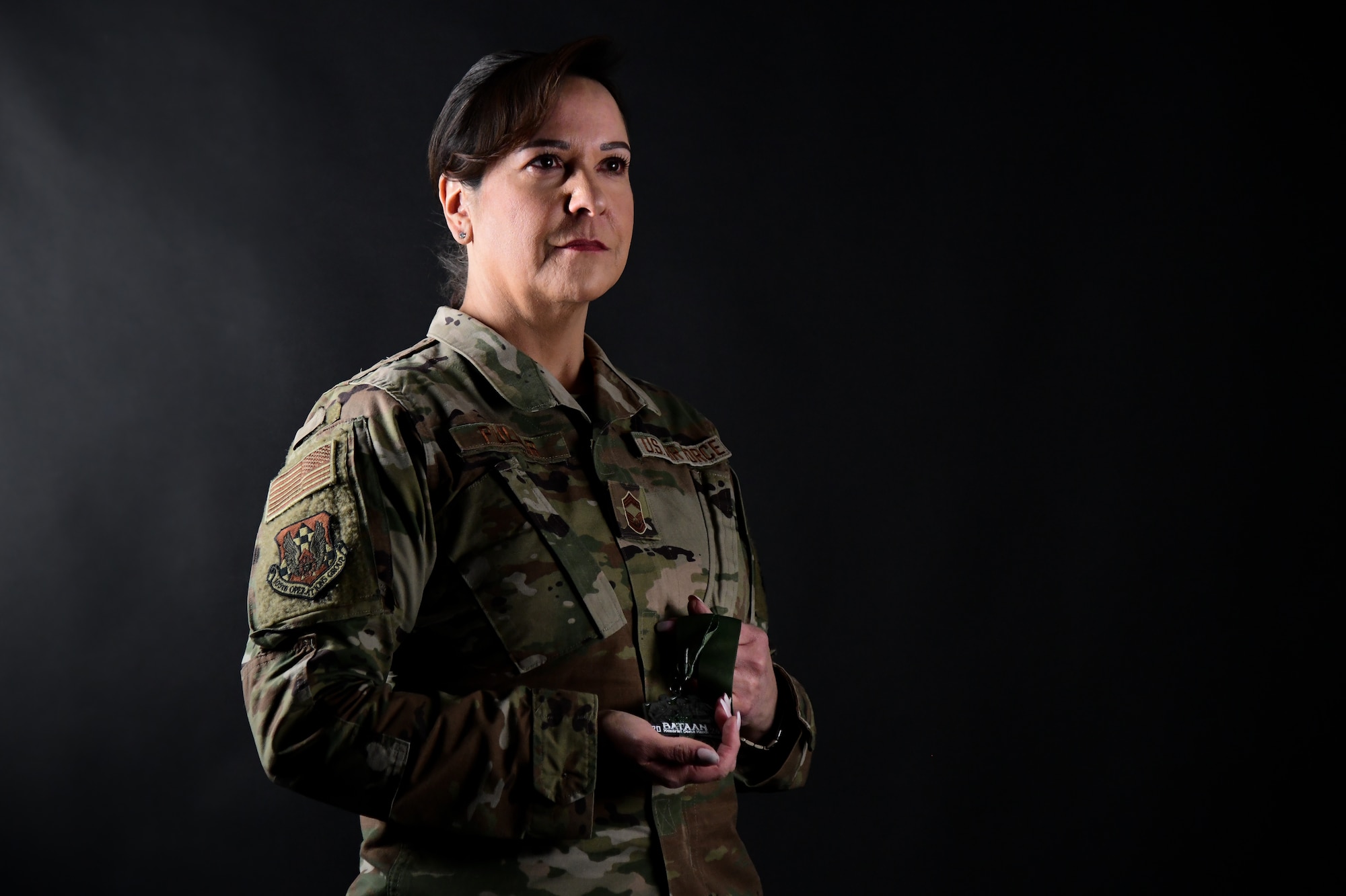 Chief Pullar poses with her Bataan Memorial Death March medal.