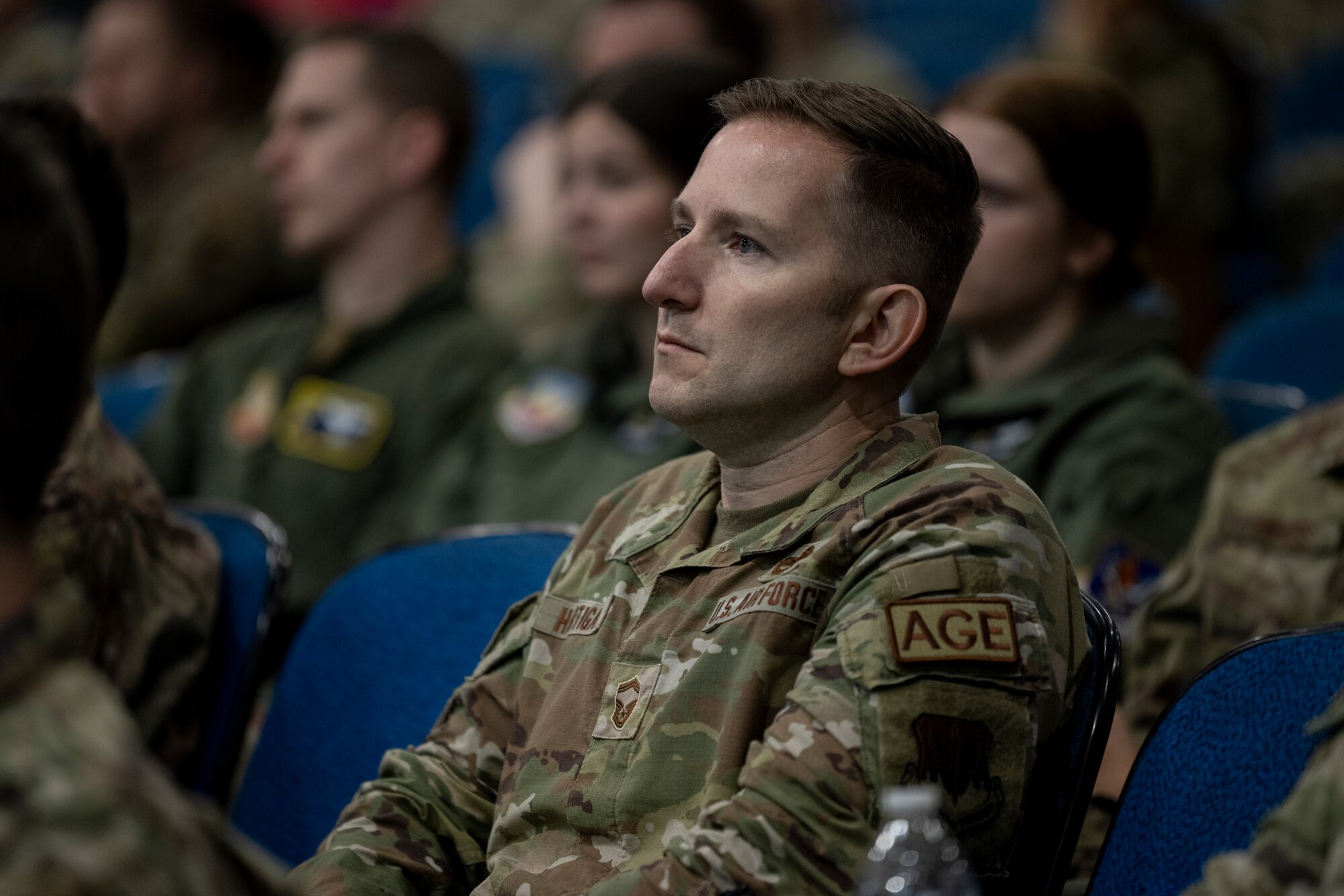 U.S. Air Force Senior Master Sgt. Daniel Hartigan, 23rd Maintenance Squadron Aerospace Ground Equipment superintendent, attends a brief at Moody Air Force Base, Georgia, March 22, 2024. In preparation for the upcoming Ready Tiger exercise, China Aerospace Studies Institute came to brief Airmen and bridge the gap between the exercise and potential real-world conflict. (U.S. Air Force photo by Senior Airman Deanna Muir)