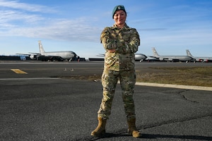 Airman stands in front of KC-135 Stratotankers