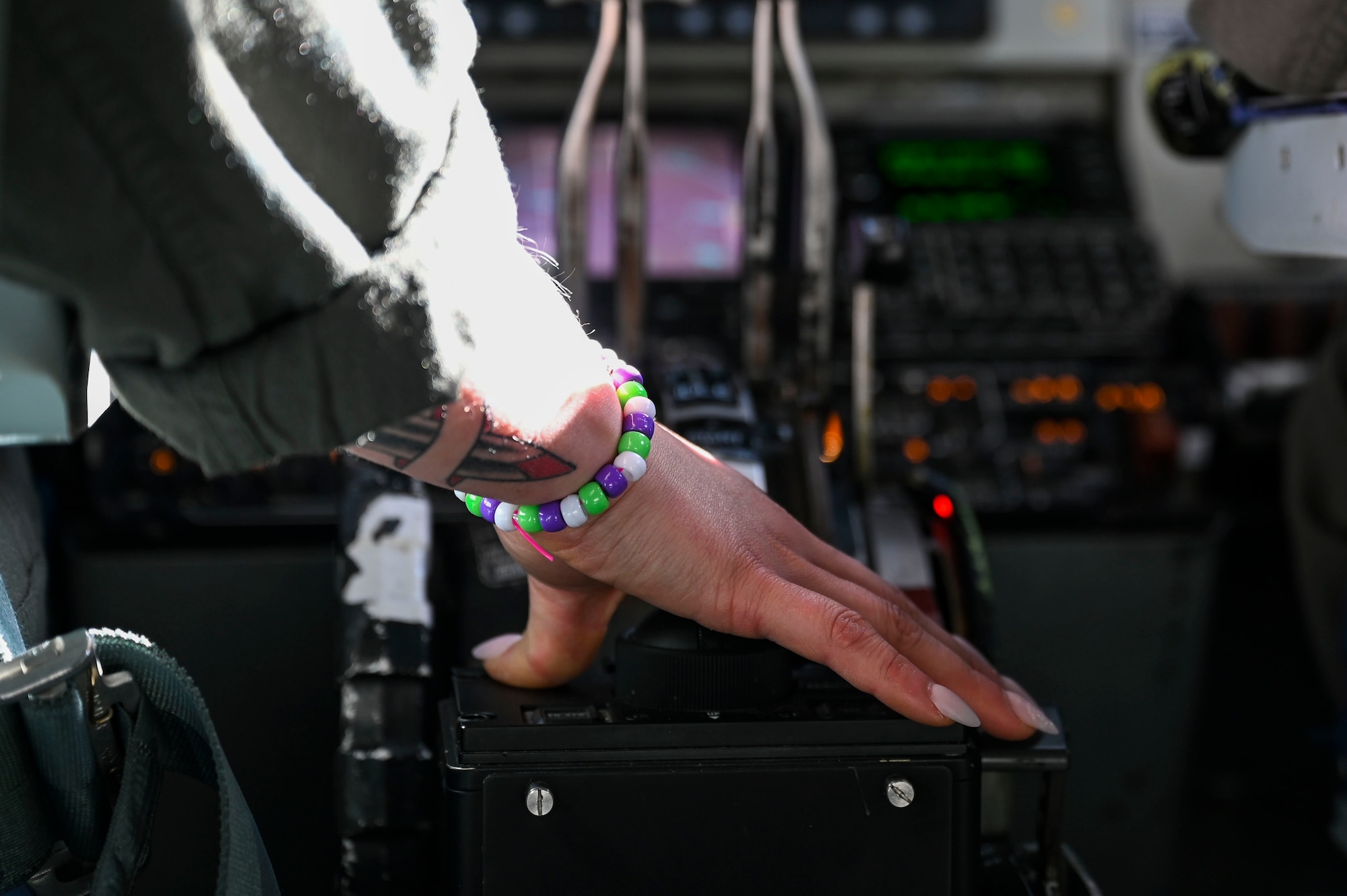 Airman's hand on flying equipment