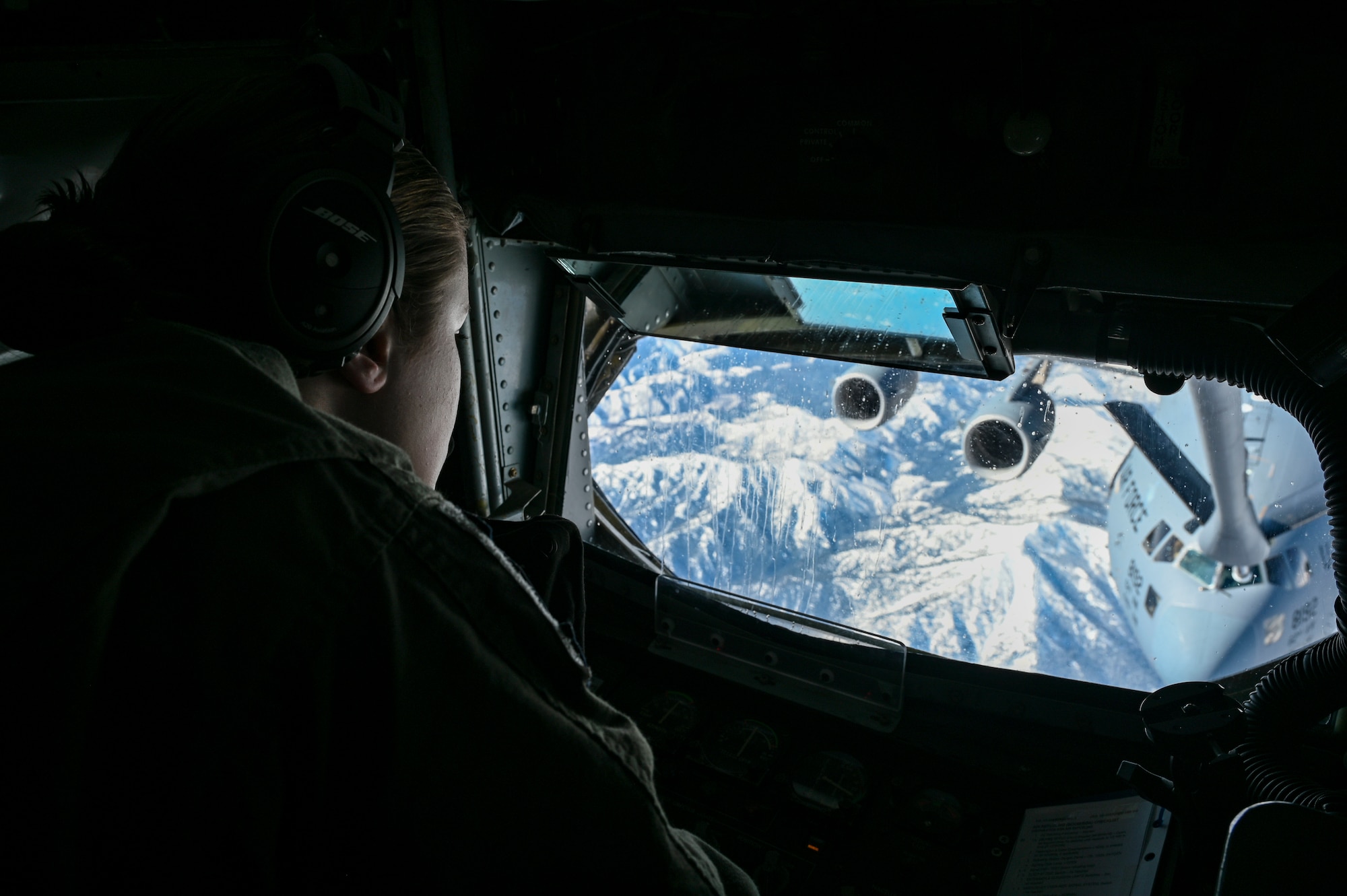 In-flight refueling specialist refuels C-17