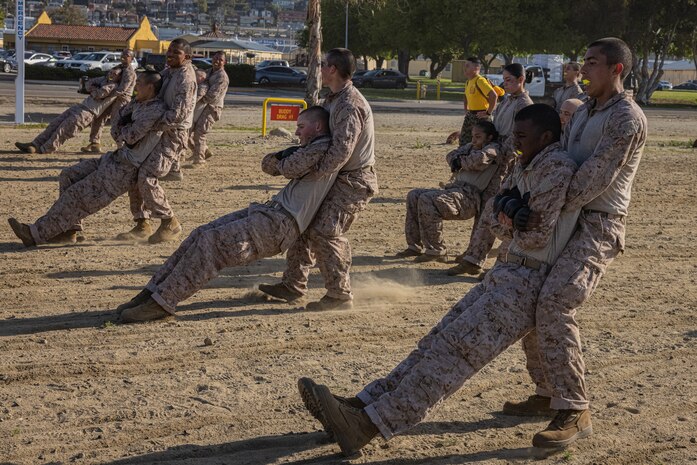 U.S. Marine Corps recruits with Fox Company, 2nd Recruit Training Battalion, execute a buddy drag technique during the combat conditioning course at Marine Corps Recruit Depot San Diego, March 27, 2024. The combat conditioning course was designed to increase recruits’ stamina. (U.S. Marine Corps photo by Lance Cpl. Jacob B. Hutchinson)