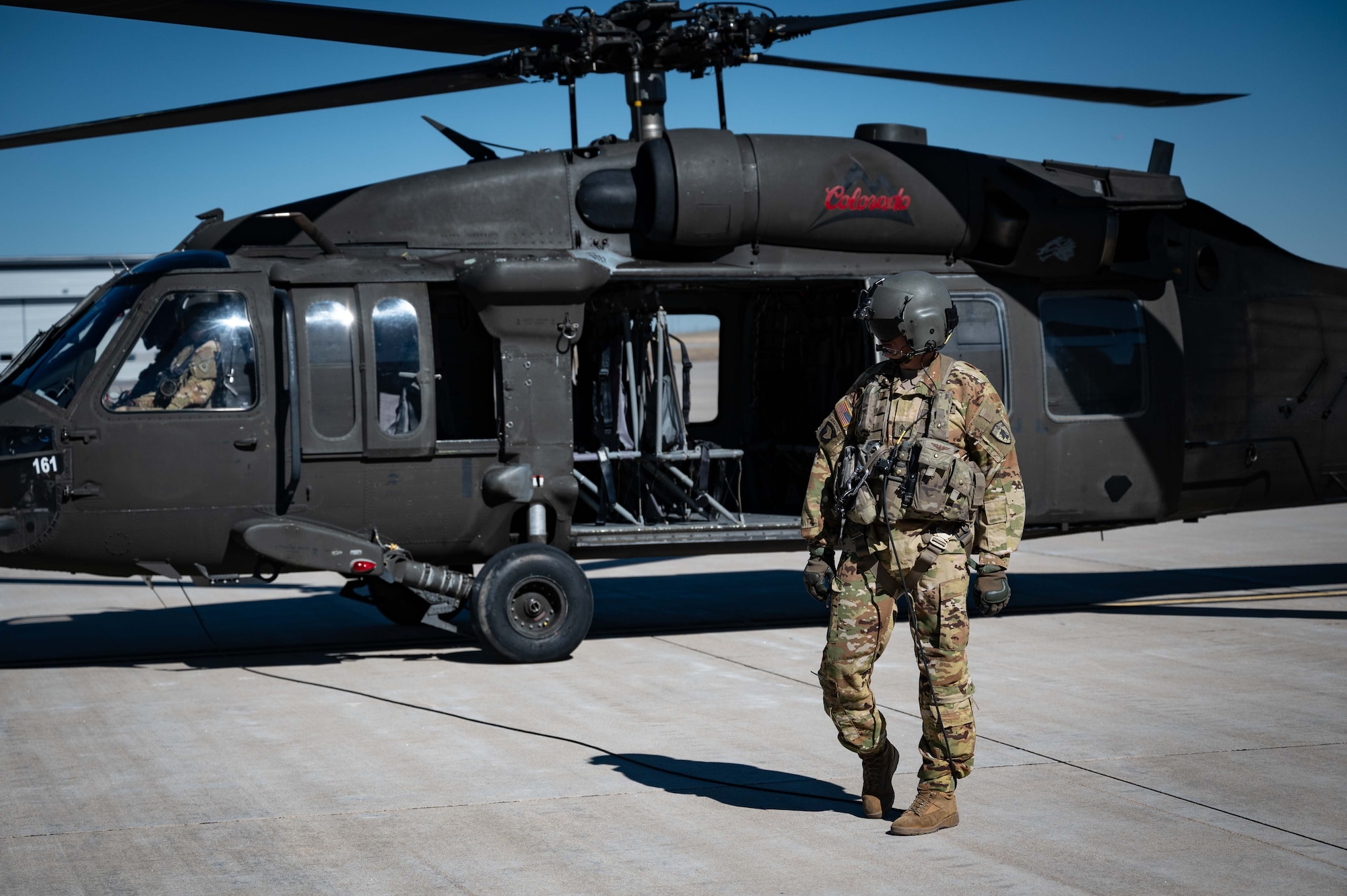 People walk away from helicopter