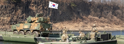 240314-Z-GO106-1008 SOUTH KOREA (March 14, 2024) Republic of Korea Army soldiers operating a tactical vehicle cross a newly constructed Improved Ribbon Bridge during a wet gap crossing training as a part of the larger exercise Freedom Shield 24, March 14, 2024, in South Korea. As one of the largest training events, FS24, tests participants with complex challenges, facilitated by observer-controllers, and includes comprehensive after-action reviews to ensure constant improvement. (Texas Army National Guard photo by Spc. Joe Cantu, 100th Mobile Public Affairs Detachment)