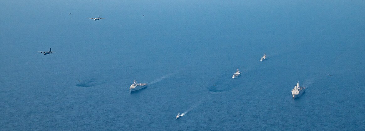 240326-N-JS660-1306 BAY OF BENGAL (March 26, 2024) U.S. Navy San Antonio-class amphibious transport dock ship USS Somerset (LPD 25), Republic of India Austin-class amphibious transport dock ship INS Jalashwa (L41), Shardul-class tank landing ship INS Kesari (L15), Shardul-class tank landing ship INS Airavat (L24) and aircraft maneuver in formation in the Bay of Bengal, Mar. 26, 2024, during Exercise Tiger TRIUMPH 2024. Tiger TRIUMPH is a U.S.-India tri-service amphibious exercise focused on humanitarian assistance and disaster relief readiness and interoperability. (U.S. Navy photo by Mass Communication Specialist 2nd Class Evan Diaz)