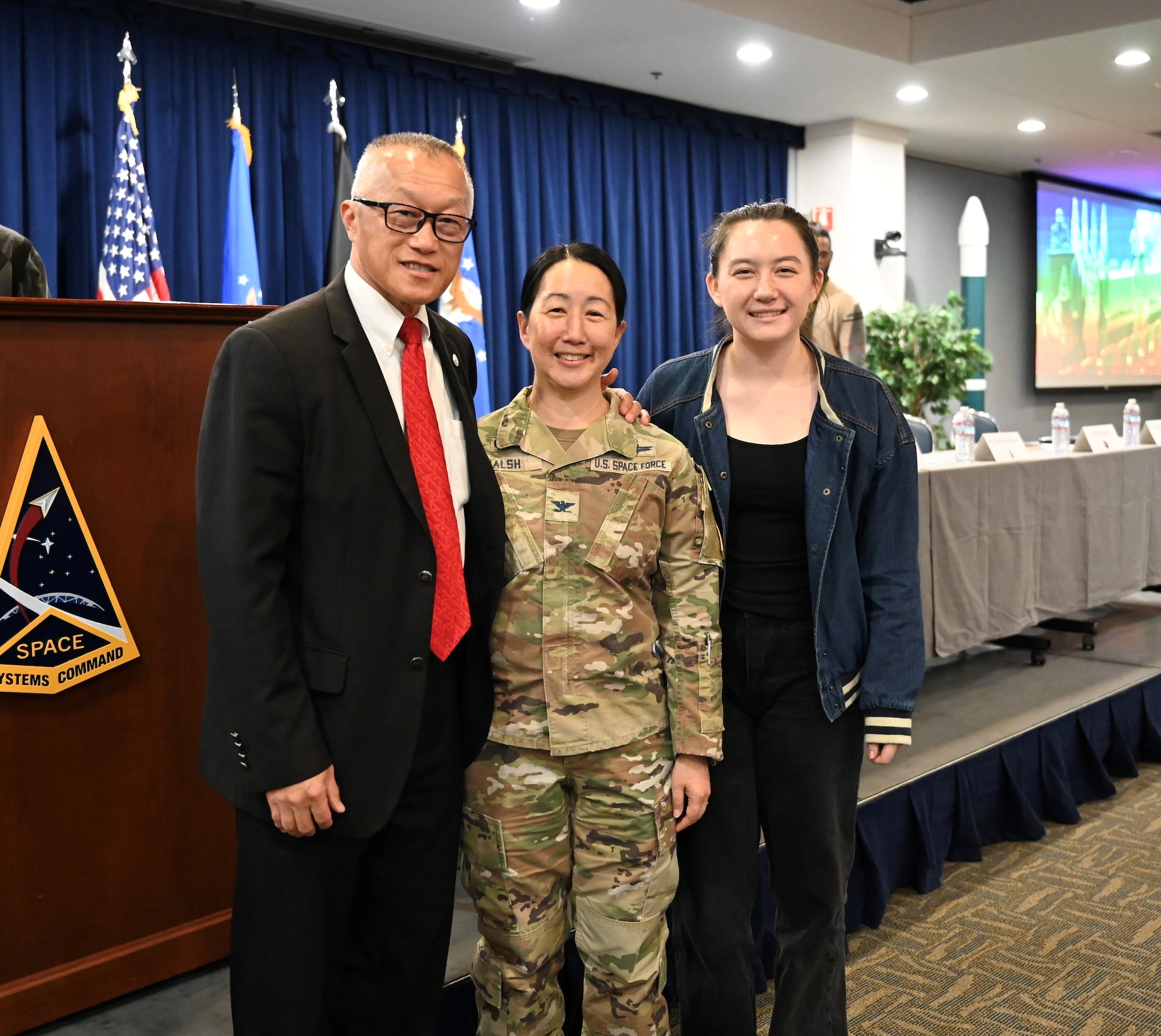Standing center in the photo is Space Base Delta 3 Commander, Colonel Mia Walsh at Los Angeles Air Force Base’s Women In Leadership Panel with Mayor George Chen, City of Torrance on the left. Her daughter, Taylor Walsh, is pictured on the right.