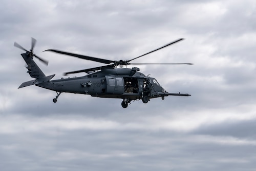 U.S. Air Force Airmen assigned to the 41st Rescue Squadron fly an HH-60W Jolly Green II over Moody Air Force Base, Georgia, March 26, 2024. The 41st RQS simulated an aircraft accident response exercise involving a hard landing. This exercise tested the communication and response of Moody AFB Airmen from various units across the 23rd Wing. (U.S. Air Force photo by Senior Airman Deanna Muir)