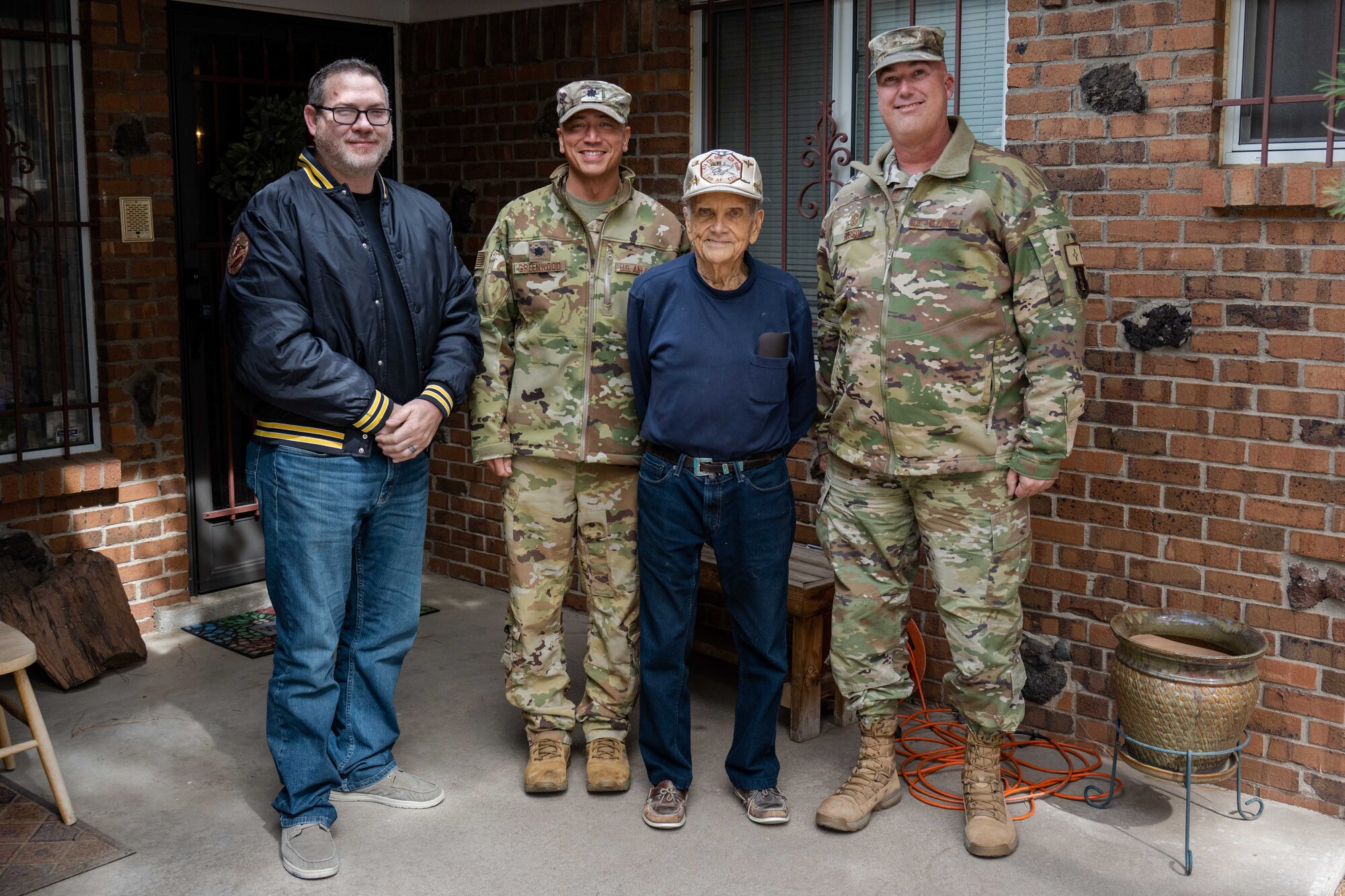 150th Special Operations Wing members pose for a picture with James Stark.