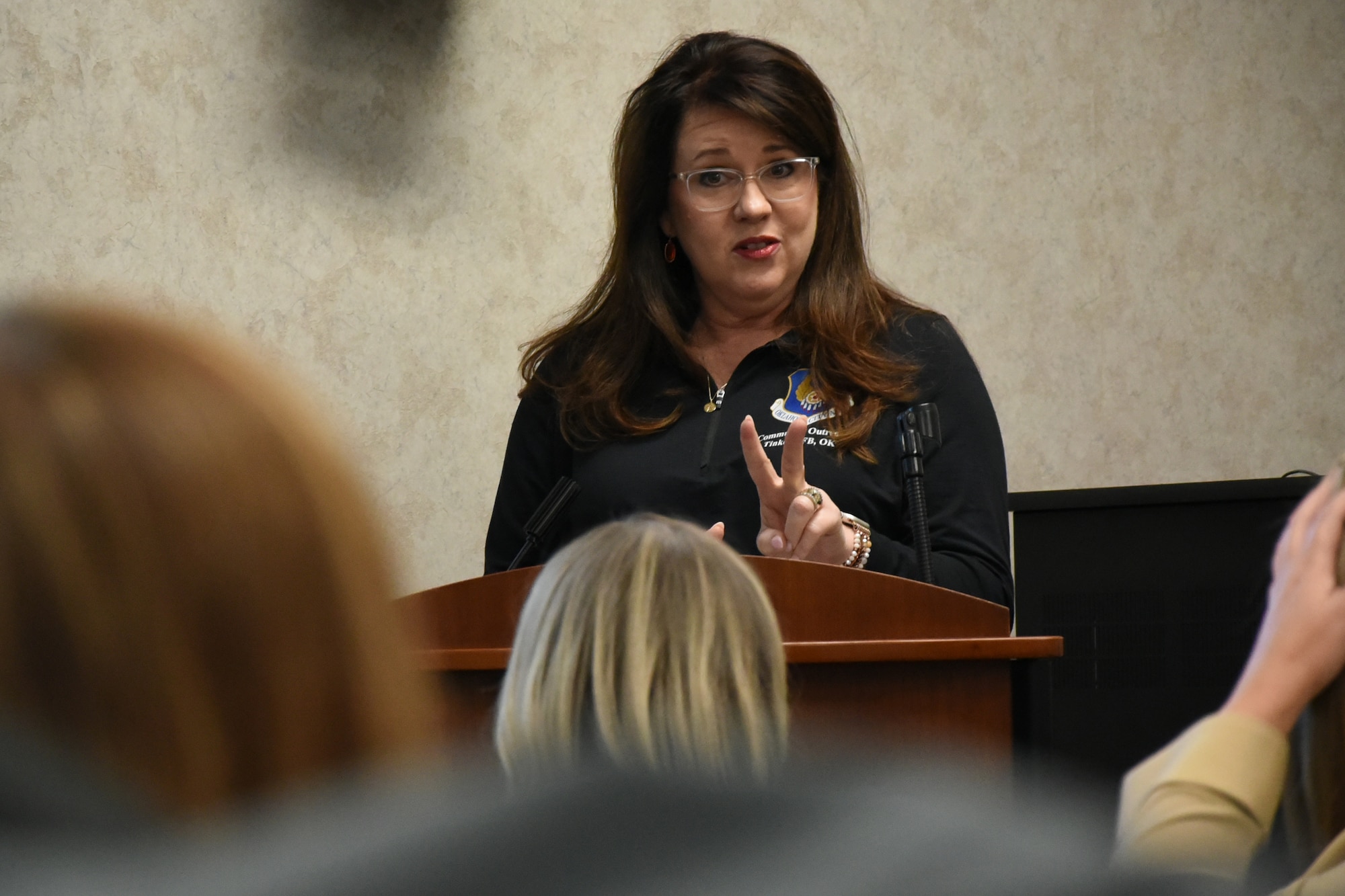 Tina Murphy speaks from a podium
