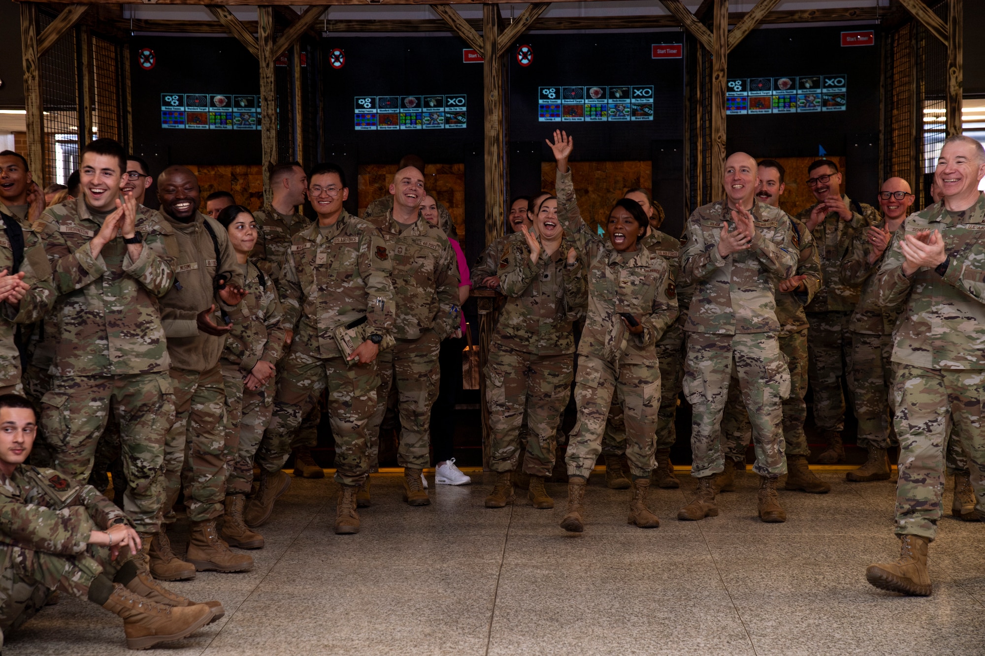 Airmen stand in a group during a function