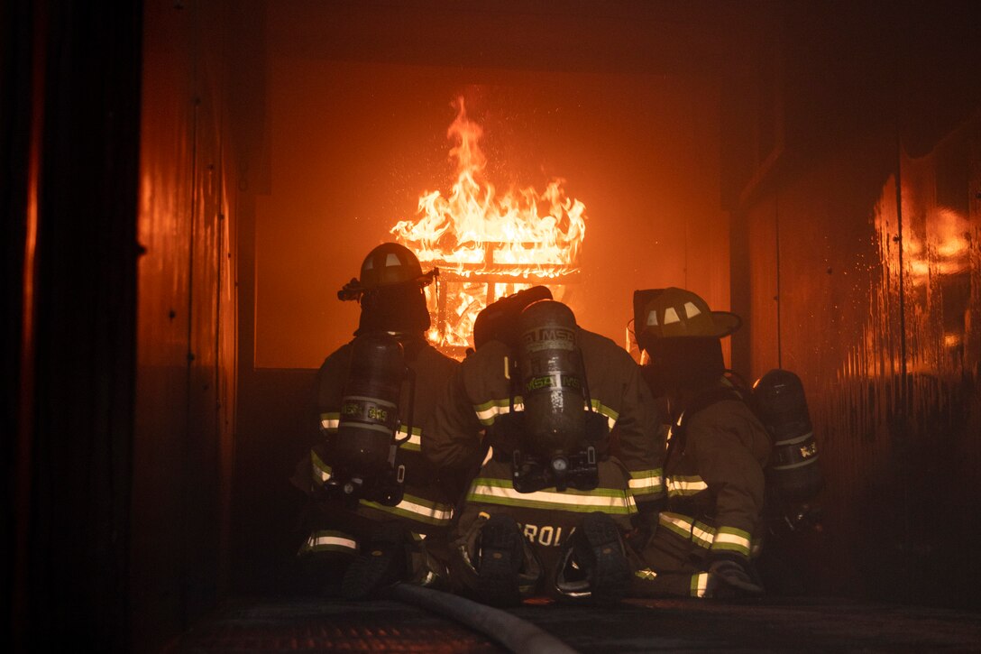 U.S. Marines with Marine Wing Support Squadron (MWSS) 171, Marine Aircraft Group 12, 1st Marine Aircraft Wing, and Airmen with the 51st Civil Engineer Squadron, 51st Mission Support Group, 51st Fighter Wing take part in firefighting training during Warrior Shield 24.