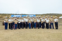 U.S. Marines with the III Marine Expeditionary Force band and the Japan Ground Self-Defense Force Central band pose for a photo during the Reunion of Honor ceremony on Iwo To, Japan, March 30, 2024. The 79th annual Reunion of Honor ceremony commemorates the veterans who fought for their respective countries on this hallowed ground; their battle has inspired future generations to value and maintain peace, security and stability in the Indo-Pacific region and beyond. (U.S. Marine Corps photo by Sgt. Christian M. Garcia)