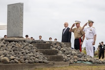 U.S. Marine Corps Lt. Gen. Roger B. Turner, center, the commanding general of III Marine Expeditionary Force, U.S. Navy Rear Adm. Carl Lahti, right, Commander, U.S. Naval Forces Japan / Commander, Navy Region Japan, and Mr. Raymond Greene, United States deputy chief of mission to Japan, salute the Reunion of Honor monument during the Reunion of Honor ceremony on Iwo To, Japan, March 30, 2024. The 79th annual Reunion of Honor ceremony commemorates the veterans who fought for their respective countries on this hallowed ground; their battle has inspired future generations to value and maintain peace, security and stability in the Indo-Pacific region and beyond. (U.S. Marine Corps photo by Sgt. Christian M. Garcia)