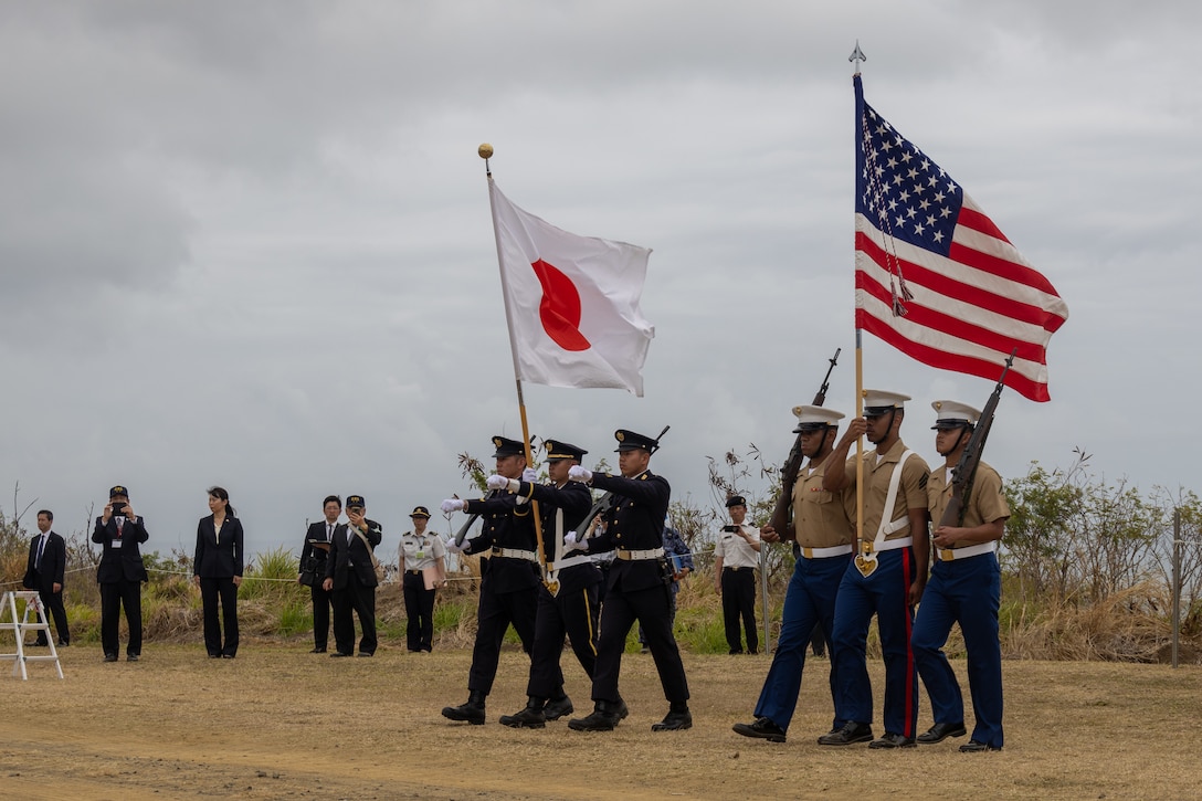 U.S. Marines with the III Marine Expeditionary Force color guard and Japan Ground Self-Defense Force color guard march during the Reunion of Honor ceremony on Iwo To, Japan, March 30, 2024. The 79th annual Reunion of Honor ceremony commemorates the veterans who fought for their respective countries on this hallowed ground; their battle has inspired future generations to value and maintain peace, security and stability in the Indo-Pacific region and beyond. (U.S. Marine Corps photo by Sgt. Christian M. Garcia)