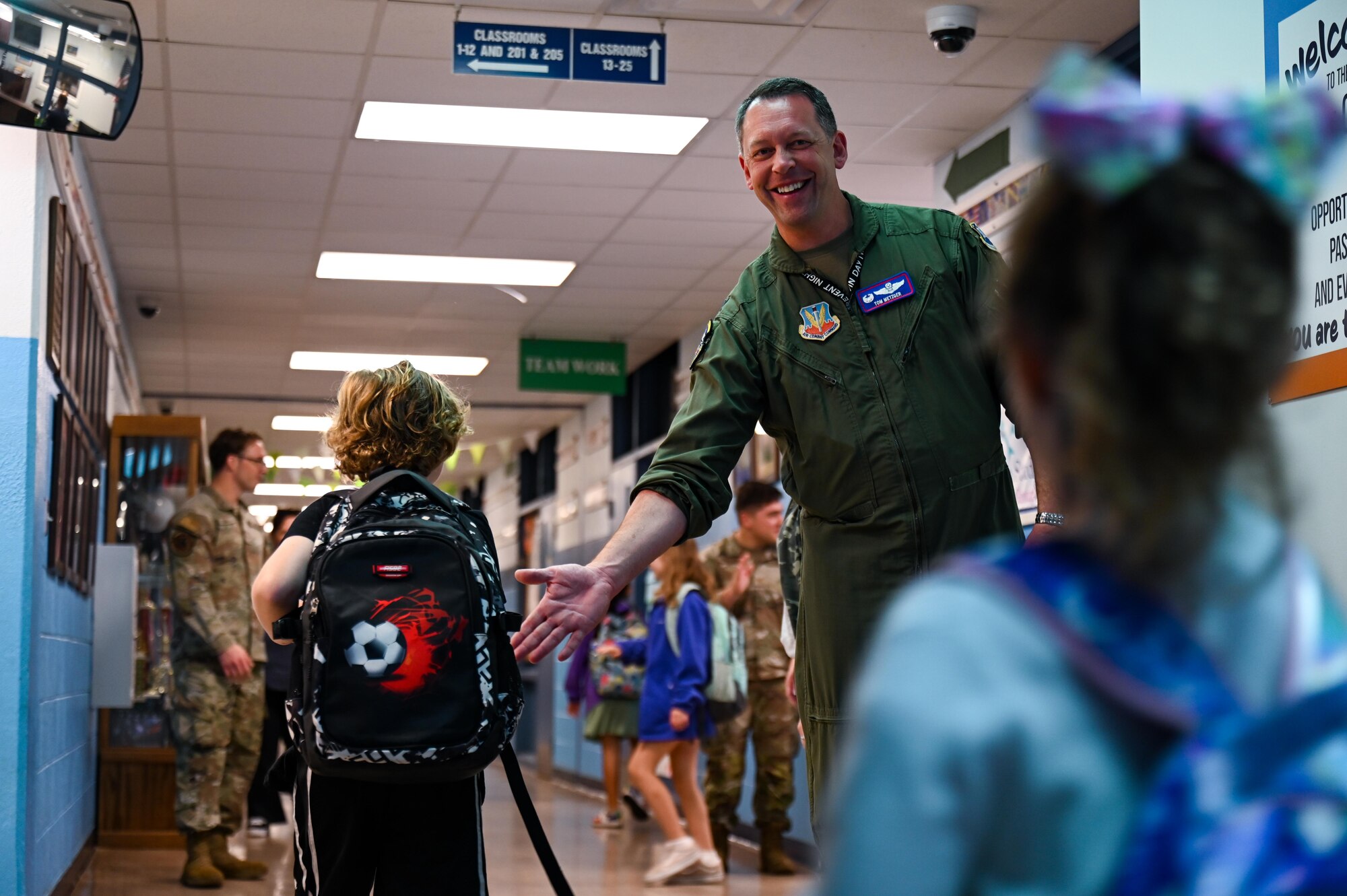 U.S. Air Force Lt. Col. Thomas Metzger, 87th Electronic Warfare Squadron commander, greets students during Military Monday at Shalimar Elementary, Shalimar, Florida, April 29, 2024. The principal of Shalimar Elementary serves as the 87th EWS’ honorary commander, and invited Airmen to participate in the school’s Military Monday. (U.S. Air Force photo by Capt. Benjamin Aronson)
