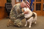 After a six-month deployment, Chaplain Lt. Col. Stephen Peters is reunited with his dog, Adele, at the Iowa Air National Guard’s 185th Air Refueling Wing in Sioux City, Iowa, April 30, 2024. Peters was serving as deputy command chaplain for U.S. Air Force Central Command at Al Udeid Air Base in Qatar while Adele continued her duties as the morale support dog at the Iowa Air National Guard’s 185th Air Refueling Wing.