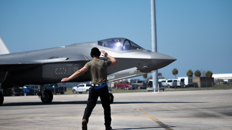 U.S. Airman First Class Bryan Arancibia, 355th Aircraft Maintenance Squadron crew chief, signals to an F-35A Lightning II pilot assigned to the 354th Fighter Wing, Eielson Air Force Base, Alaska, during Weapons System Evaluation Program 23.05 at Tyndall AFB, Florida, Feb. 22, 2023. WSEPs are formal, two-week evaluation exercises designed to test a squadron’s capabilities to conduct live-fire weapons systems during air-to-air combat training missions. (U.S. Air Force photo by Senior Airman Anabel Del Valle)