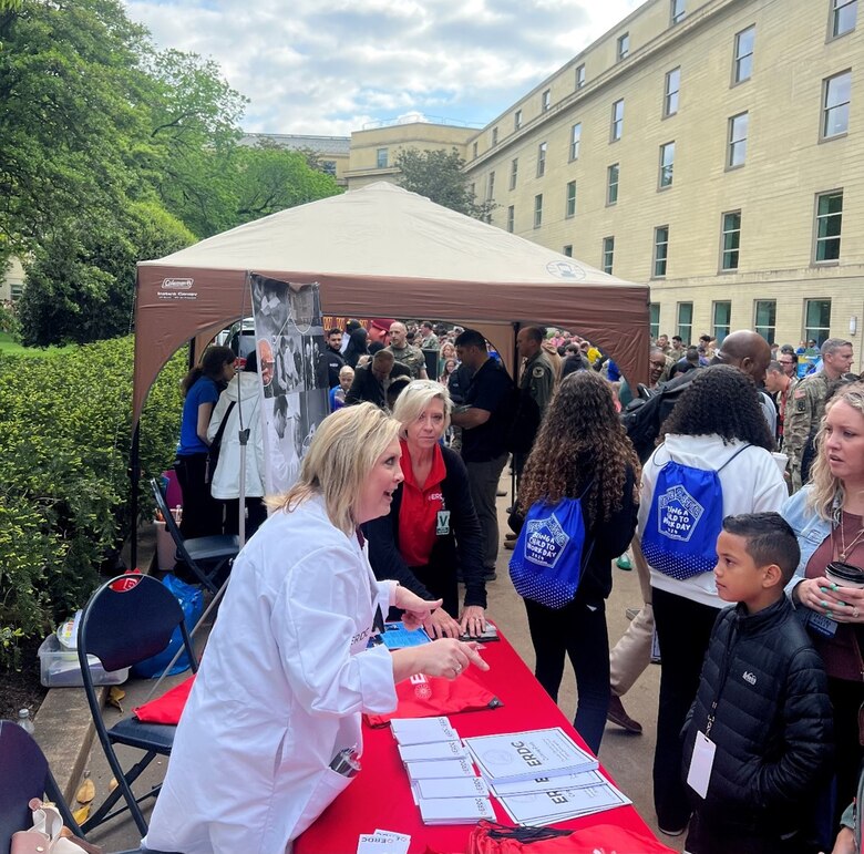Annette Kirklin from ERDC's Public Affairs Office talks to participants at the Bring a Child to Work Day event at the Pentagon, April 25, 2024. Throughout the event, children of all ages were able to learn all about the exciting and innovative research and development projects and programs conducted at ERDC.