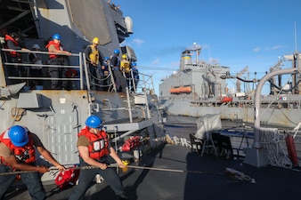USS Howard (DDG 83) replenishes from USNS John Ericsson (T-AO 194) in the South China Sea.