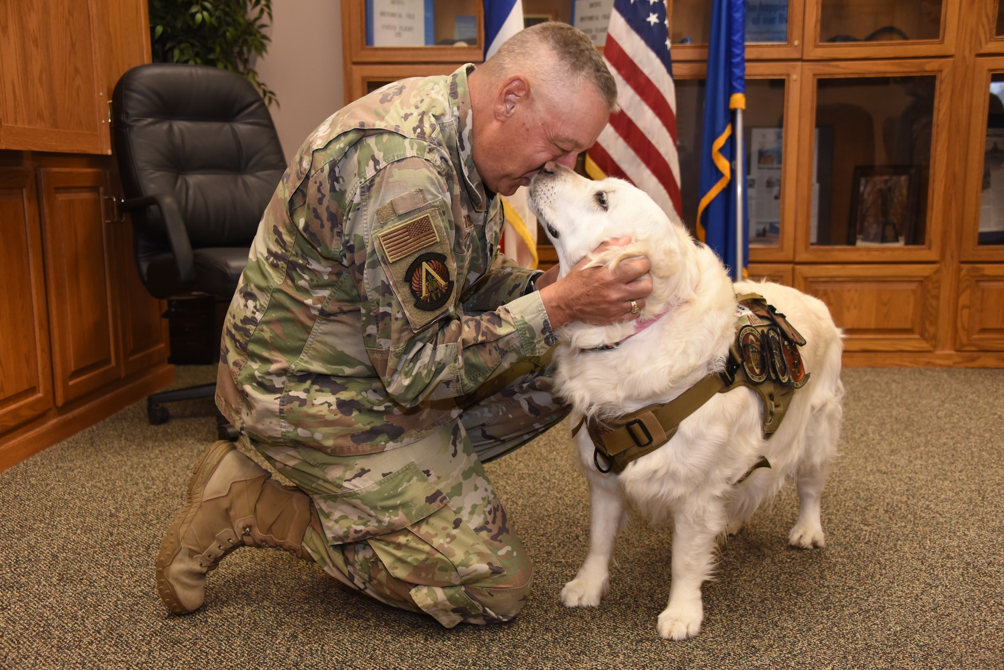 After a six-month deployment, Chaplain Lt. Col. Stephen Peters is reunited with his dog, Adele, at the Iowa Air National Guard’s 185th Air Refueling Wing in Sioux City, Iowa, April 30, 2024. Peters was serving as deputy command chaplain for U.S. Air Force Central Command at Al Udeid Air Base in Qatar while Adele continued her duties as the morale support dog at the Iowa Air National Guard’s 185th Air Refueling Wing.