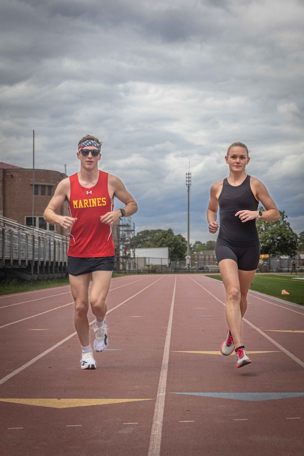 U.S. Marine Corps Cpl. Tyler Halliday, a water maintenance technician, and 1st Lt. Logan Book, executive officer of Combat Engineer Company, both with 8th Engineer Support Battalion, Combat Logistics Regiment 27, 2nd Marine Logistics Group, train on Camp Lejeune, North Carolina, April 4, 2024, prior to competing in the 128th Boston Marathon. Halliday and Book qualified to compete in the Boston Marathon as a member of the All-Marine Running Team through their hard work and dedication. (U.S. Marine Corps photo by Cpl. Jackson Kirkiewicz)
