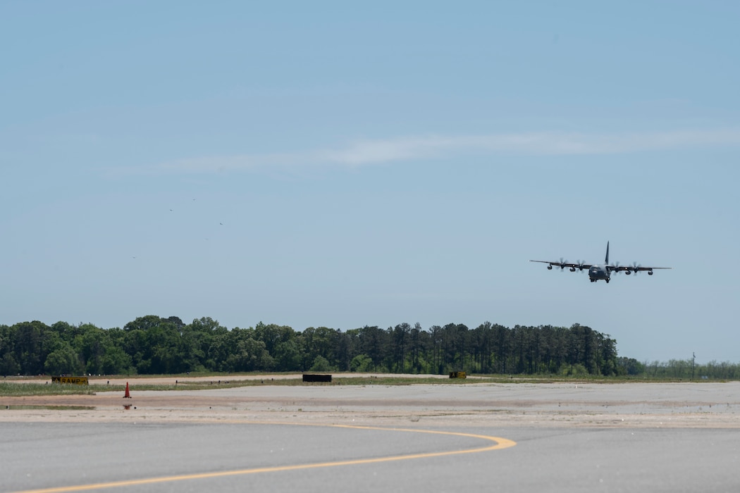 An HC-130 Landing on a runway.