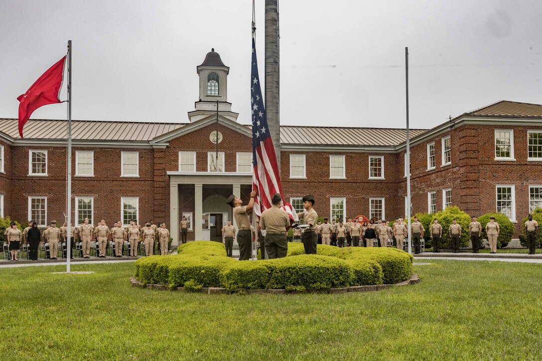 U.S. Marines with 2nd Marine Logistics Group, present morning colors before an awards ceremony on Camp Lejeune, North Carolina, April 26, 2024. During the ceremony Marines and Sailors with 2nd MLG were awarded and recognized for their efforts and discipline during the second quarter of the 2024 calendar year. (U.S. Marine Corps photo by Cpl. Jackson Kirkiewicz)