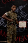 U.S. Marine Corps Sgt. David Hamptonfurr, a drill instructor with Instructions Training Company, Support Training Battalion, poses for a photo with the Navy and Marine Corps Achievement Medal at Marine Corps Recruit Depot San Diego, California, April 19, 2024. Hamptonfurr received this award due to his courageous actions by saving an individual after witnessing a car accident. (U.S. Marine Corps photo by Cpl. Joshua M. Dreher)