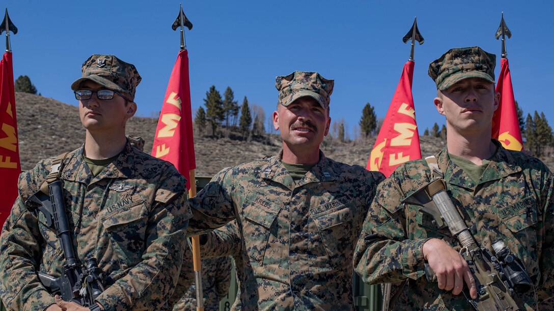 U.S. Marine Corps Capt. Samuel D. Krebs, center, a logistics officer with 3rd Battalion, 6th Marine Regiment, 2d Marine Division (MARDIV) gives remarks on Cpl. Skylar J. Lawrence, right, a transmissions system operator with 3rd Battalion, 6th Marine Regiment, 2DMARDIV and Petty Officer 3rd Class Stanley R. Lipinsky, a corpsman with 3rd Battalion, 6th Marine Regiment, MARDIV during a battalion formation following the conclusion of Mountain Warfare Training Exercise (MTX) 3-24 at the Marine Corps Mountain Warfare Training Center in Bridgeport, California April 9, 2024. The Marines and Sailors were each awarded a Navy and Marine Corps Achievement medal for their impact and efficiency during MTX. (U.S. Marine Corps photo by Lance Cpl. Noelia Vazquez)​