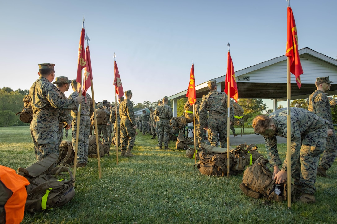 U.S. Sailors with 2d Marine Division (MARDIV) participate in a six mile hike during the Doc Kent competition on Camp Lejeune, North Carolina, April 23, 2024. This hike is held annually to commemorate Aaron A. Kent, a U.S. Navy Hospitalman, who was assigned with 2d MARDIV, II Marine Expeditionary Force and killed in action during combat in Operation Iraqi Freedom in 2005. (U.S. Marine Corps photo by Pfc. Micah Thompson)